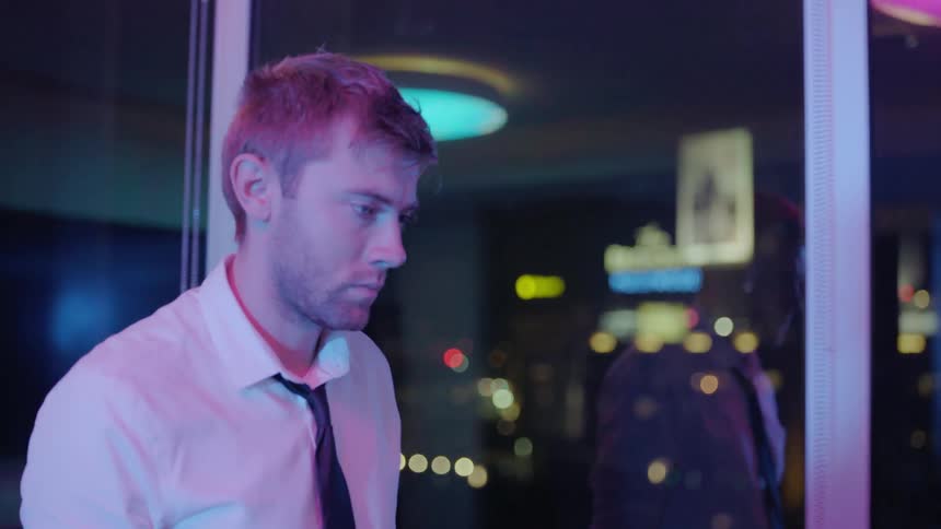 A man walks past the windows