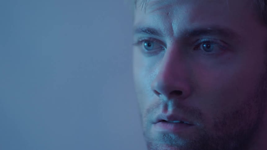 A man looks around nervous