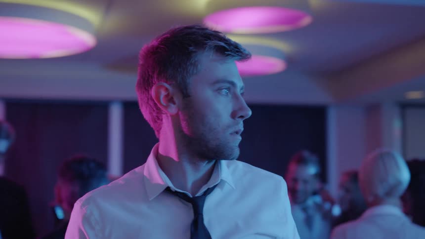 A man standing around in a room