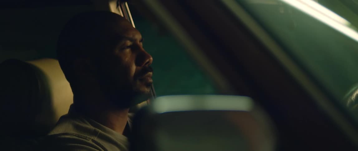 A man is sitting in his vehicle