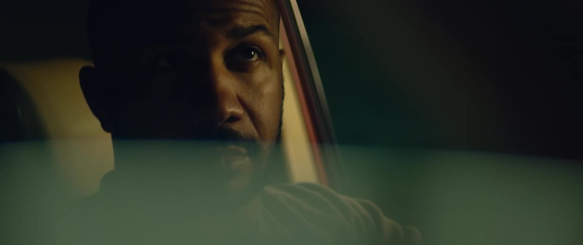 A man is sitting in his car