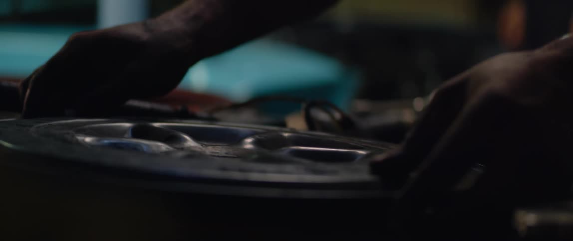 A mechanic working on a car