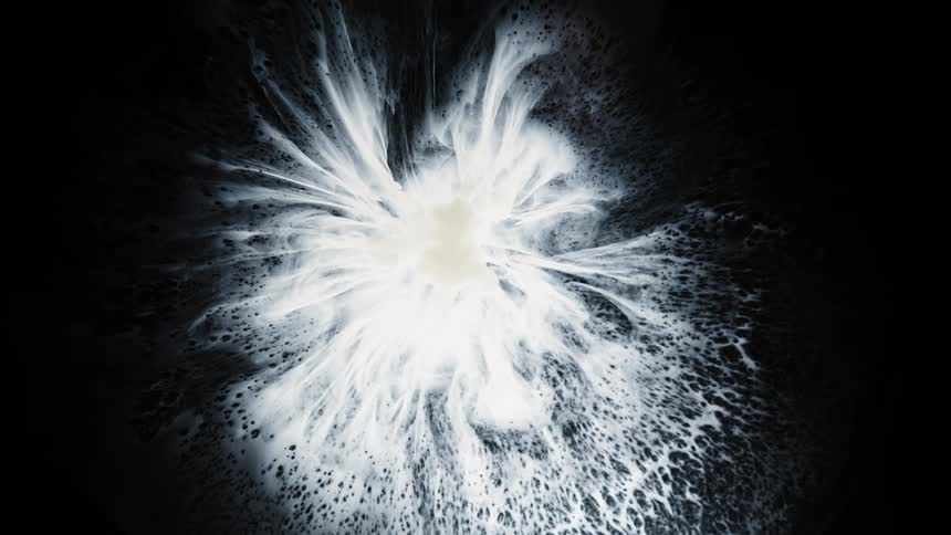 A white powder explodes into a star like pattern