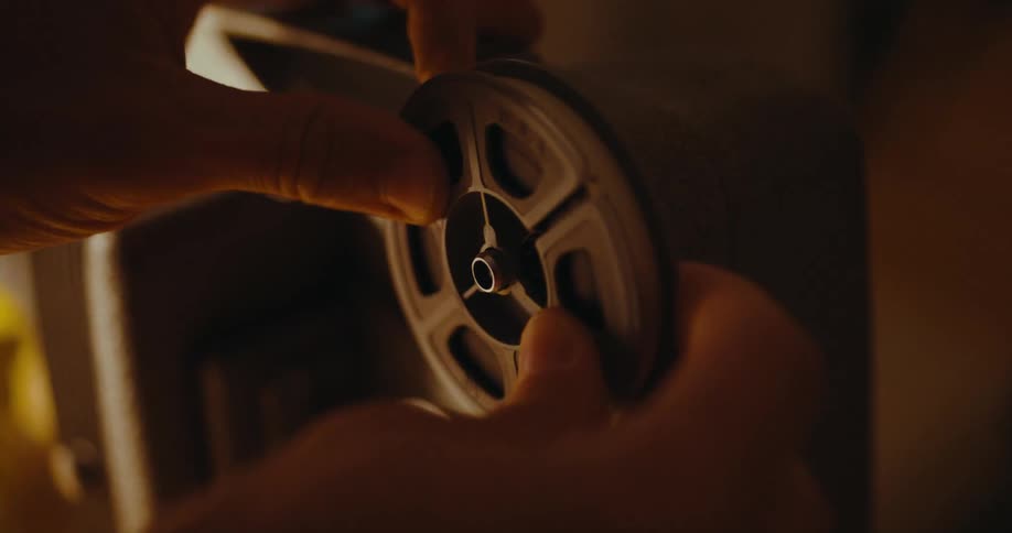 A person is putting film on a photo camera