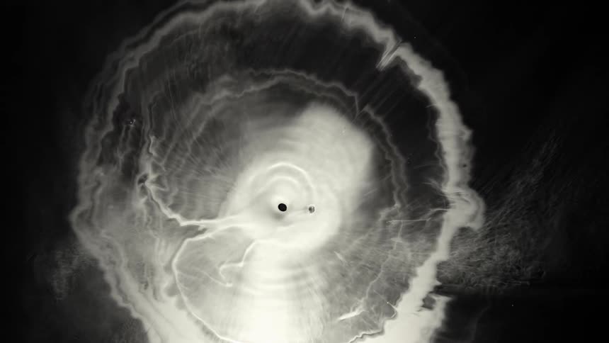 An overhead view shows the time progression of a large hurricane as the eyewall changes shapes and reforms