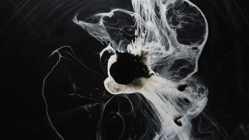 Abstract footage of liquid dye mixing in water