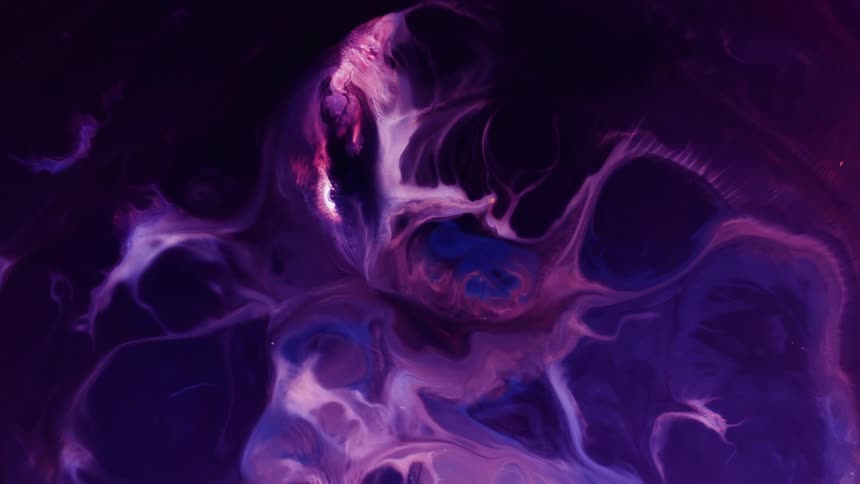 An illuminated lavender substance moves and grows in a deep purple environment