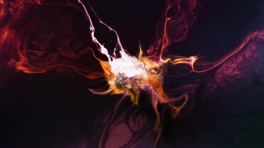 Red flames rise and spread out over the fire