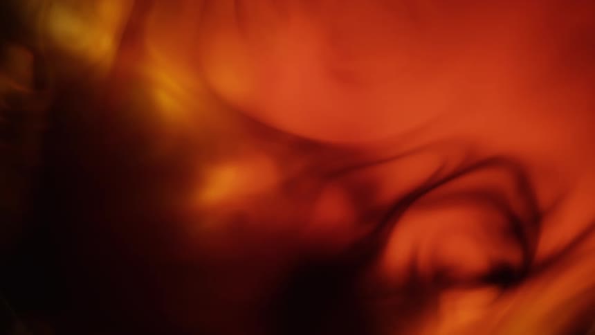Black and red vapor swirls as it spreads