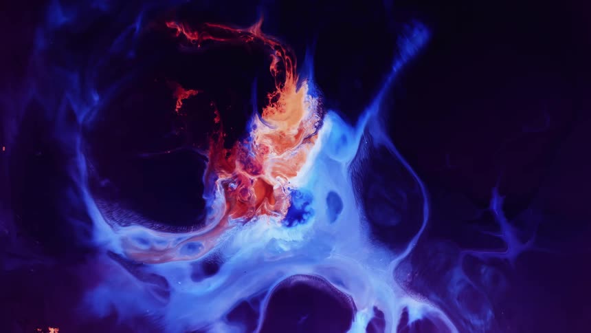Red and blue vapors swirl in the darkness