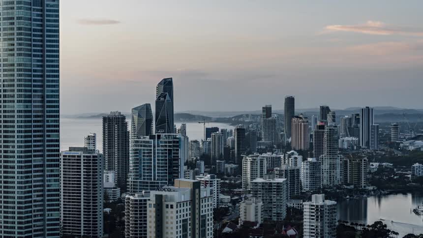 Aerial view of city condos and office buildings next to sea in the city