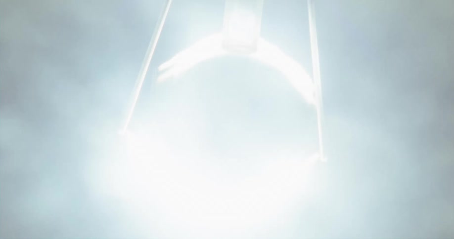 Close up of a lightbulb filament turning brightly on inside a dark room