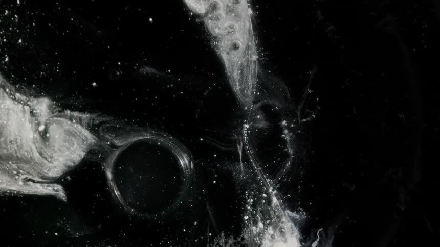 An orb moves through a debris field and explodes