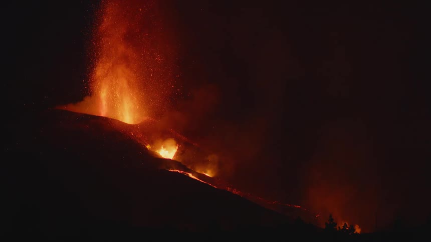 Lava shoots up from a volcano as it explodes