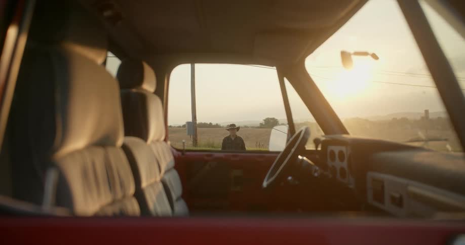 A man is standing outside the vehicle