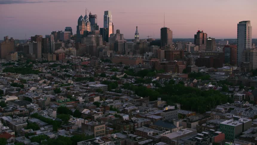 Neighborhoods in a city give way to a large downtown area full of skyscrapers