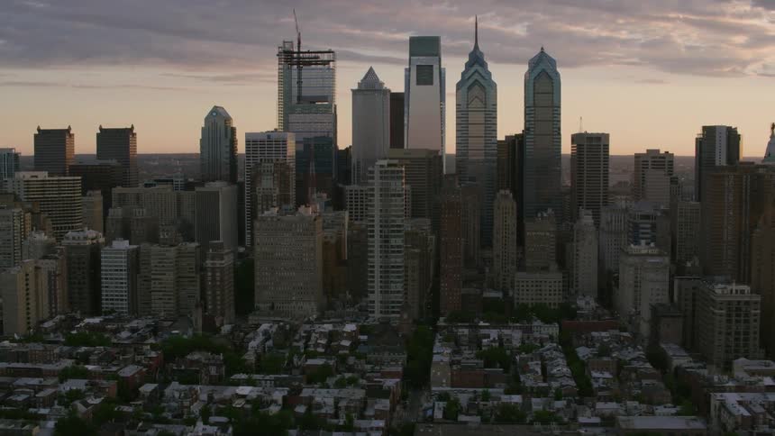 Aerial view of city skyscrapers and buildings at dusk
