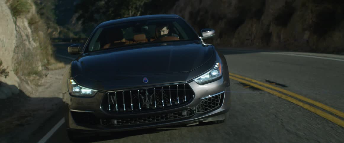 A man is driving on the road