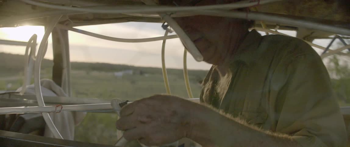 A man working on light tubes
