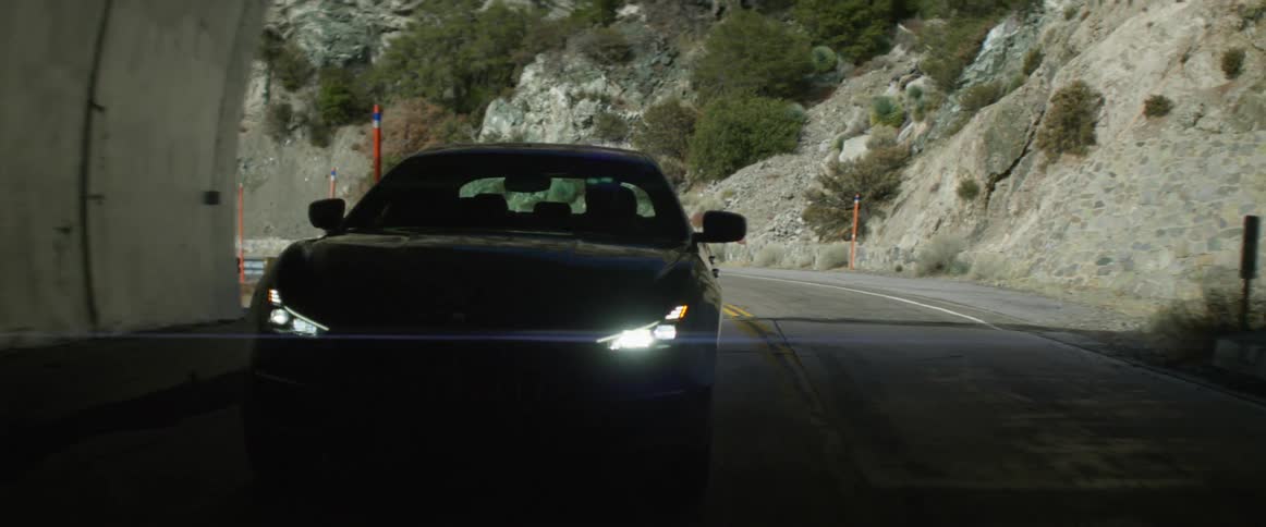 A car is driving through a tunnel