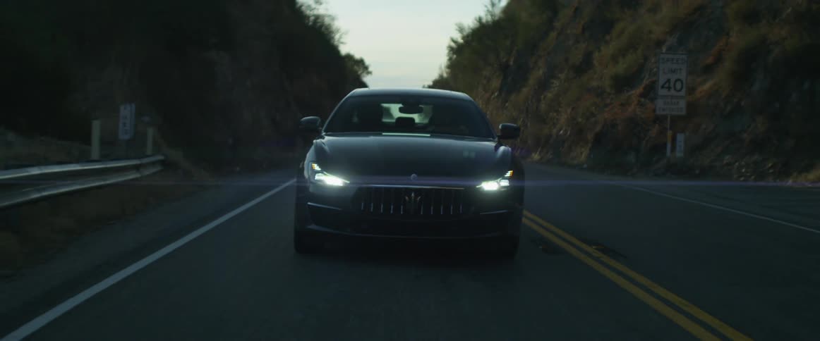 A vehicle driving down a road