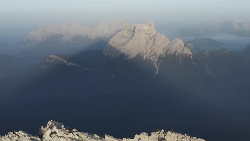 Tall mountains cast shadows off each other along the coast