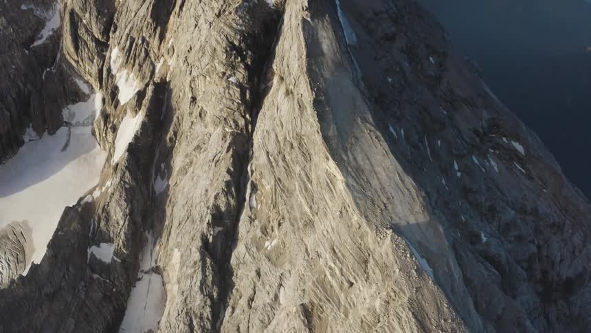 Aerial view of snow covered mountains are displayed