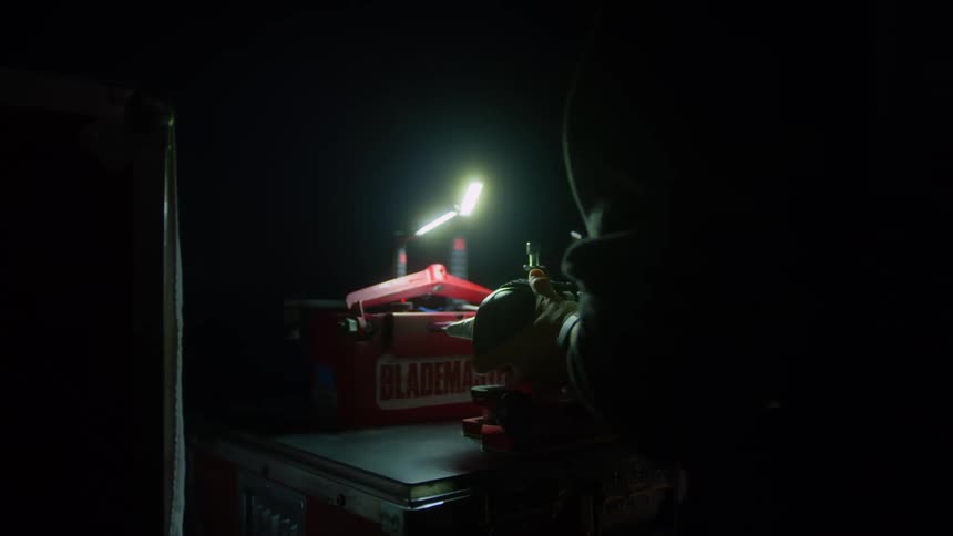 A man uses tools in a shop