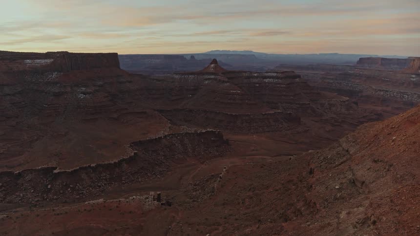 Aerial footage reveals an absolutely enormous canyon surrounded by plateaus