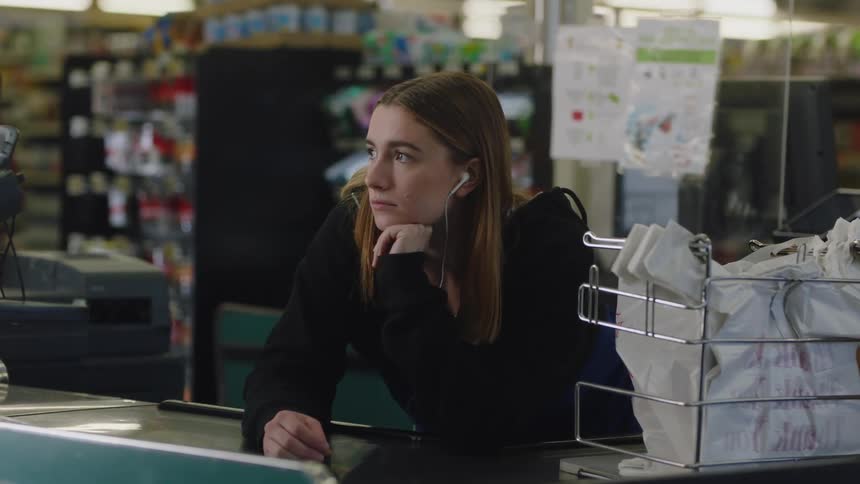 An employee greets a customer