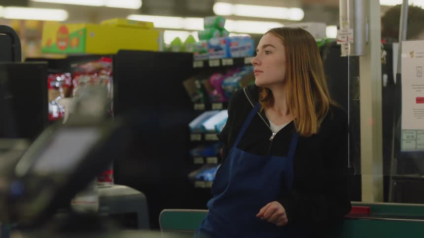 A woman working in a grocery store