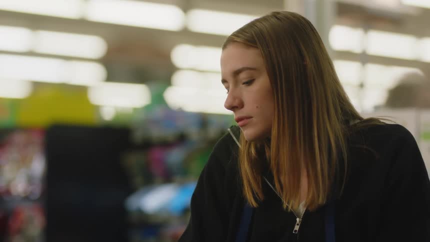 A woman working at a grocery store