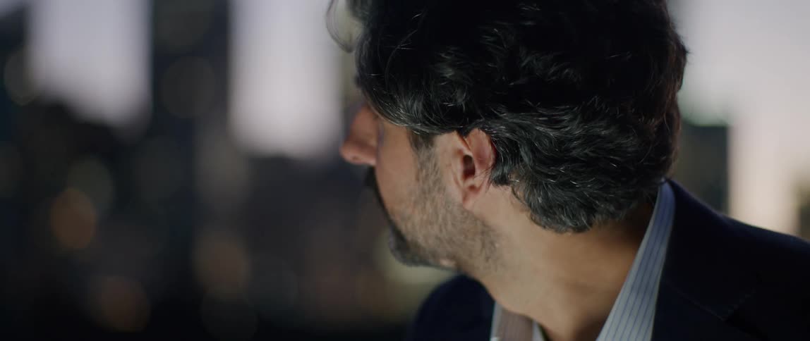 A man is looking down at something