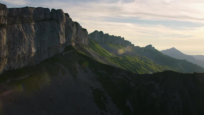 Aerial view of steep mountain ranges at dawn