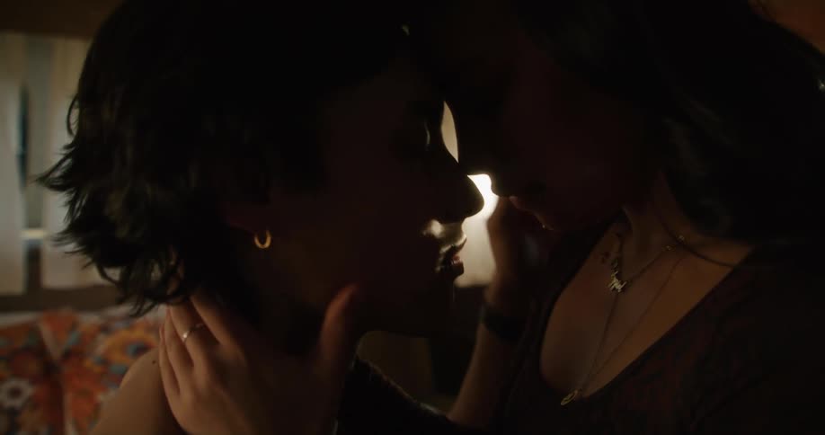 A couple kiss in the room