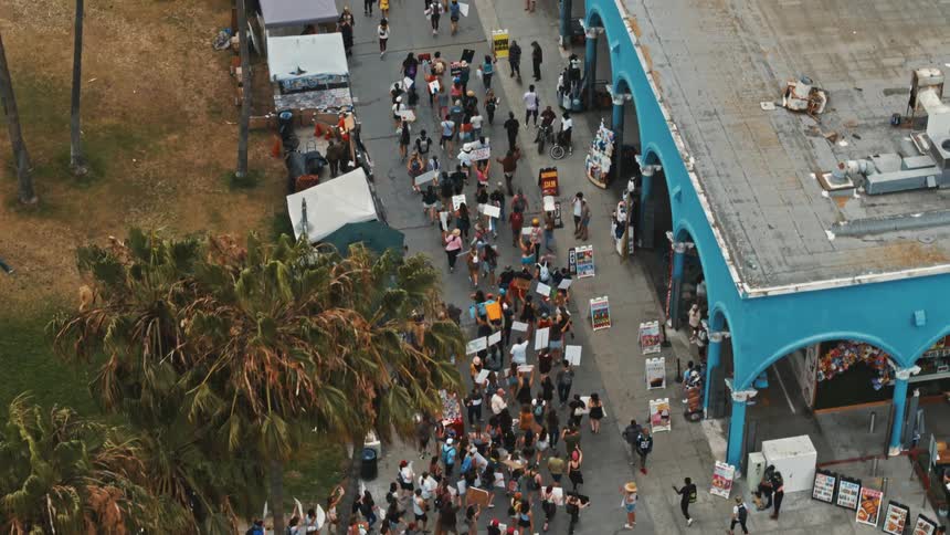 People march down a city street in a protest