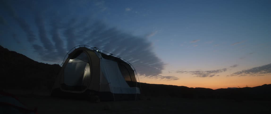 A person is setting up the tent
