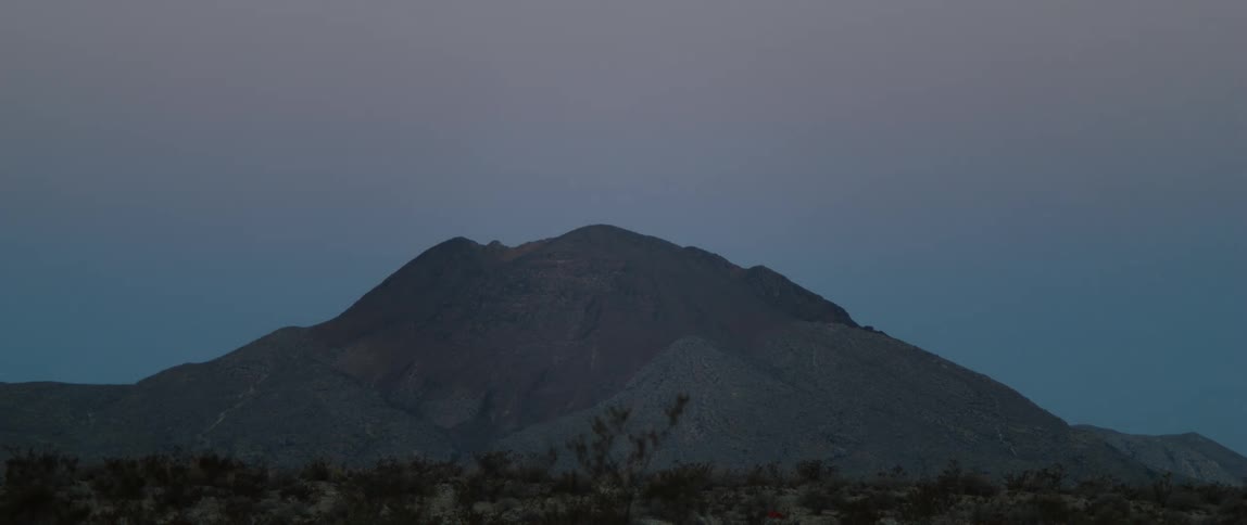 A mountain range at dusk