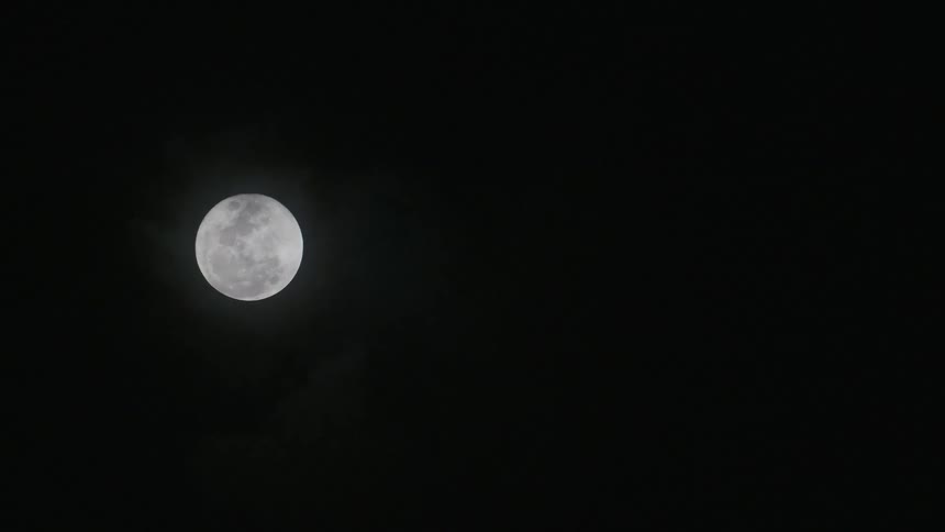 A full moon shines bright in Tulum, Mexico
