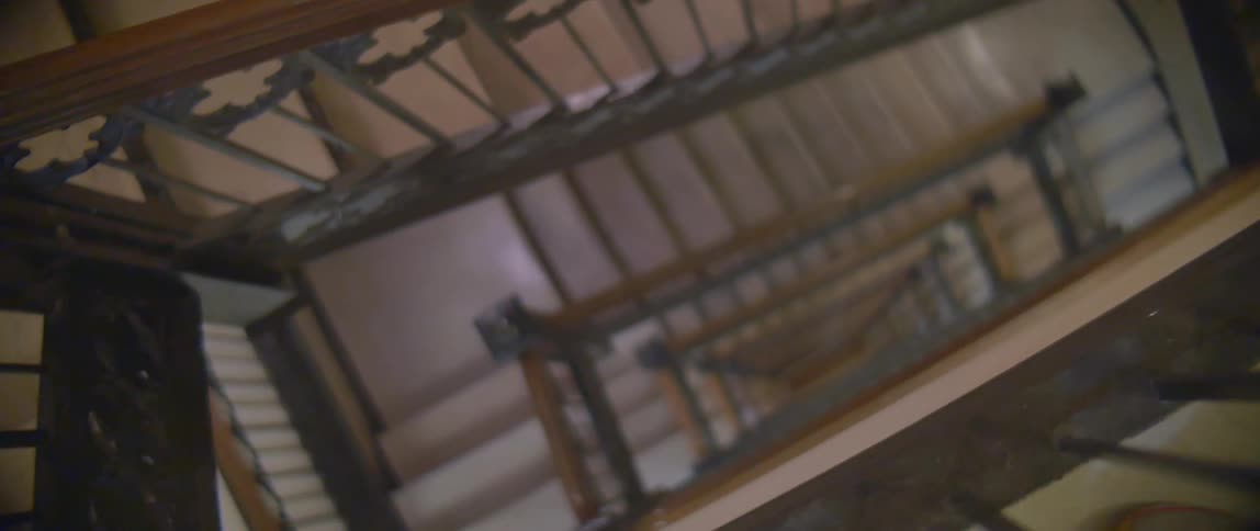 A large staircase has many floors going down