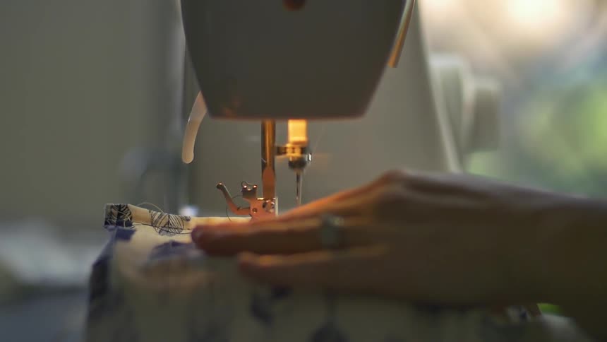 A woman using a sewing machine