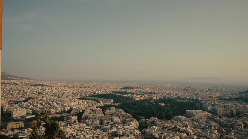 Aerial view of the low buildings on a big city skyline at evening