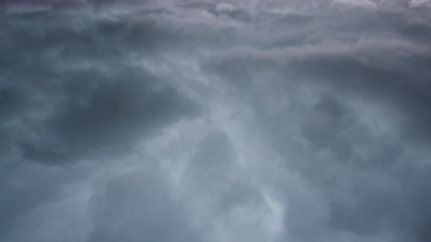 An abstract time lapse of severe storm clouds appearing like fog or a view into a deep turbulent space scene