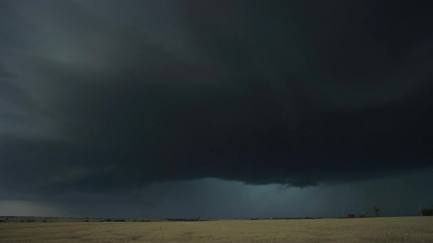 Time lapse of a huge supercell storm rotating straight towards the caerma as clouds swirl and boil towards camera