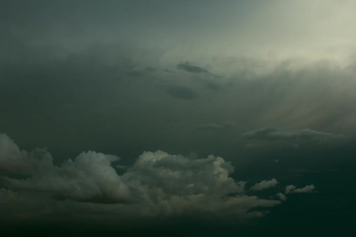 A time lapse shows dark storm clouds boil and roll into a dark night sky in Southern Colorado, USA