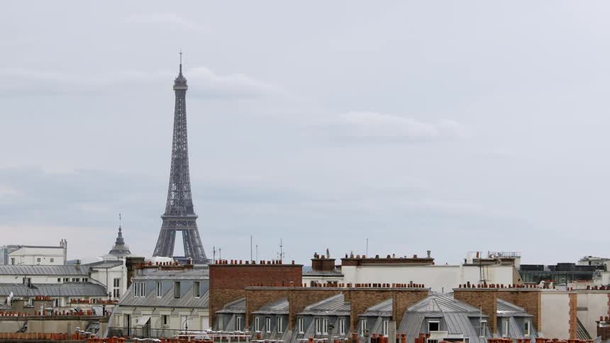 The eiffel tower over the paris skyline at daytime