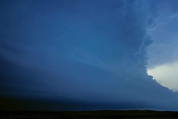 Supercell time lapse of lightning flashing and striking as clouds roll and swirl