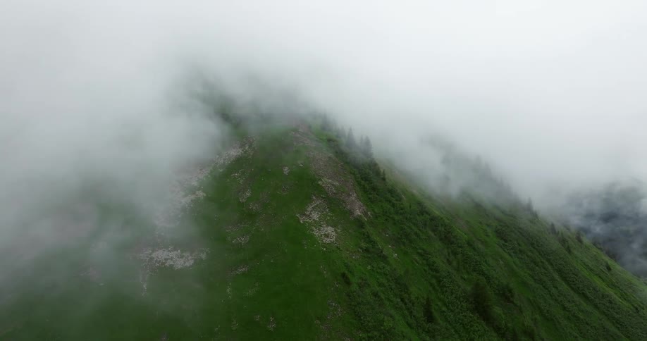 The mountains are covered with white clouds