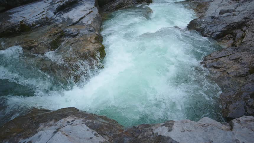 Close up of a small waterfall flowing over rocks