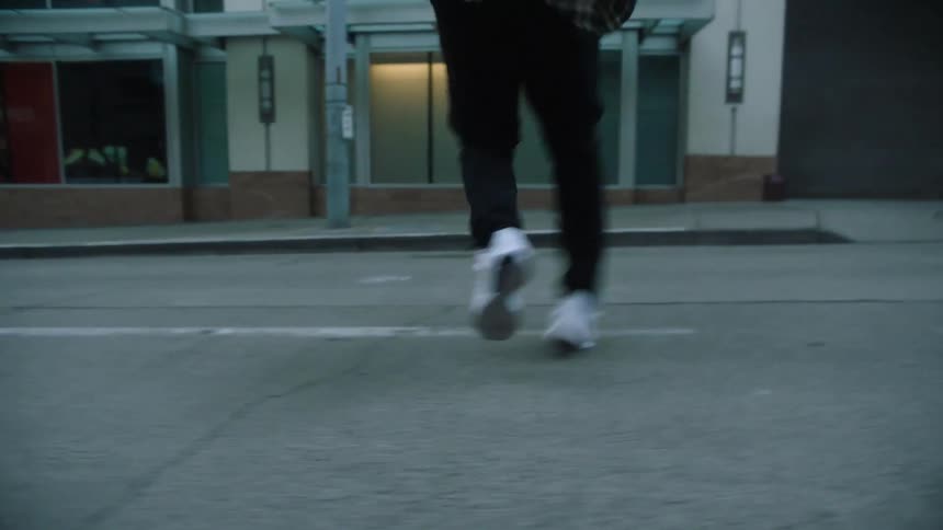 A person is dancing down the street